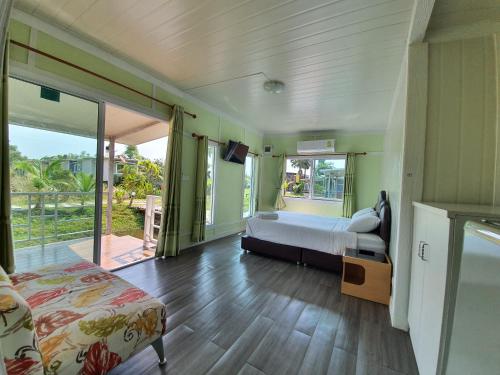 Voodi või voodid majutusasutuse Phalagoon Resort toas