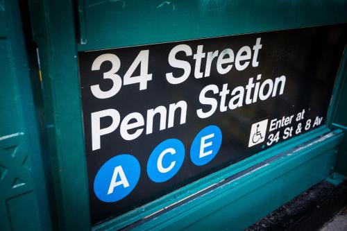 a sign in the window of a penner stationage at EVEN Hotel New York - Times Square South by IHG in New York