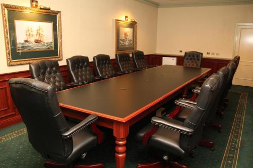 a conference room with a table and chairs at The Lawson Riverside Suites in Wagga Wagga