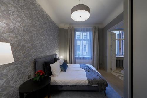 Llit o llits en una habitació de EDEN APARTMENT