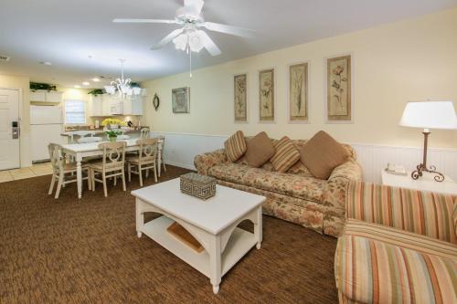 a living room with a couch and a table at Holiday Inn Club Vacations - Orlando Breeze Resort in Davenport