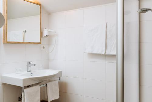 Koupelna v ubytování Hotel Kögele mit Restaurant bei Innsbruck Axamer Lizum