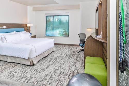 a hotel room with a bed and a tv at EVEN Hotel Ann Arbor S - University Area by IHG in Ann Arbor