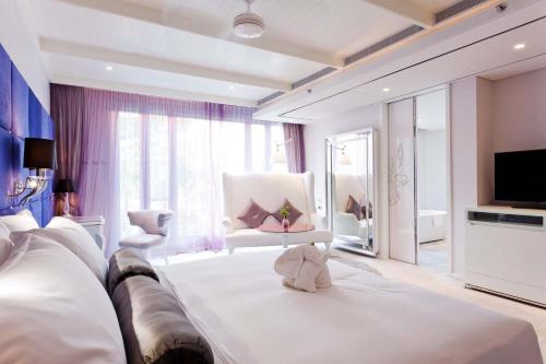 เตียงในห้องที่ Hua Chang Heritage Hotel