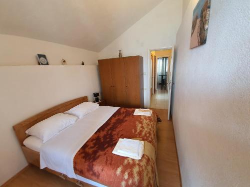 Postel nebo postele na pokoji v ubytování Apartment and Rooms Lucica