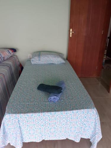 Postel nebo postele na pokoji v ubytování Chalé da Clarissinha