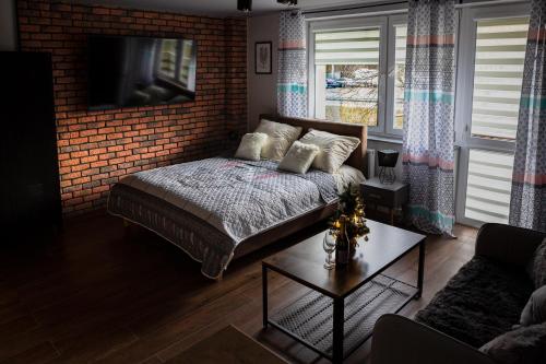 Postel nebo postele na pokoji v ubytování Apartament Wataha