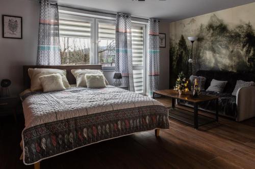 Ένα ή περισσότερα κρεβάτια σε δωμάτιο στο Apartament Wataha