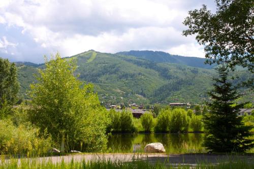 a view of a lake with a mountain in the background at Holiday Inn Steamboat Springs by IHG in Steamboat Springs