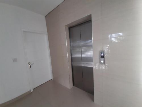 an empty room with a door in a building at Ti Coco in Pereybere