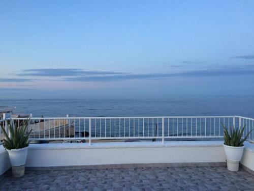 a balcony with a view of the ocean at B&B Villa S.Anna in Bari