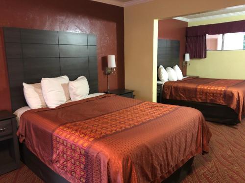 Voodi või voodid majutusasutuse Americas Best Value Presidents Inn on Munras toas