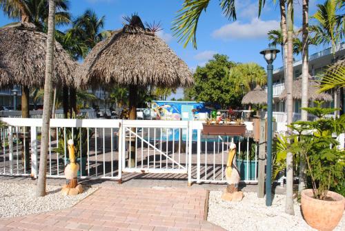 a gate at a resort with a pool at Floridian Hotel in Homestead
