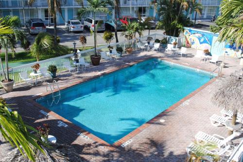 a large swimming pool with blue water in a resort at Floridian Hotel in Homestead