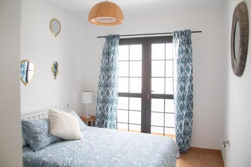 A bed or beds in a room at Arena Blanca