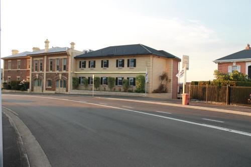 an empty street in front of a building at Coach House Launceston in Launceston