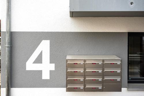 a building with a number forty four on it at REINERS Quartier - relaxed living in Bruckberg