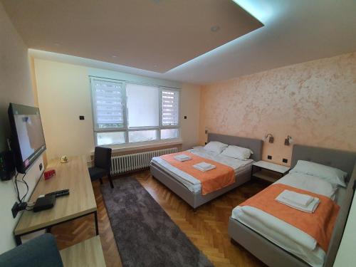 Postel nebo postele na pokoji v ubytování Apartman DoDoLu