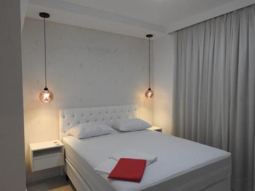 Cama o camas de una habitación en Apartamento em Bombinhas