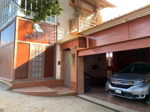 a car parked in the entrance to a building at Quinta Maria Bonita Hotel Boutique in Xalapa