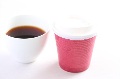 a cup of coffee next to a cup of coffee at Hotel Hokke Club Hakodate in Hakodate