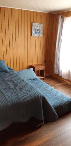 Cama ou camas em um quarto em Cabaña Quiquel, Dalcahue, Chiloe
