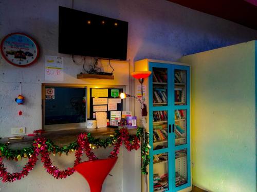 a room with a counter with christmas decorations on it at 2 Home in Chalong 