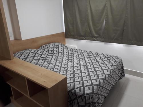 a bedroom with a bed and a dresser at Beach Class Ilha do Leite in Recife