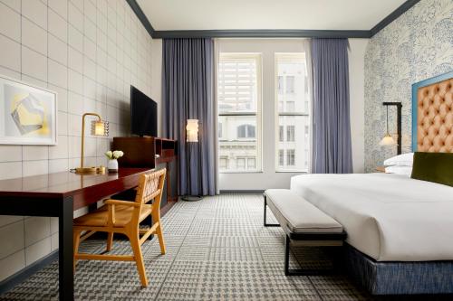a hotel room with a bed and a desk at Kimpton Hotel Monaco Denver by IHG in Denver
