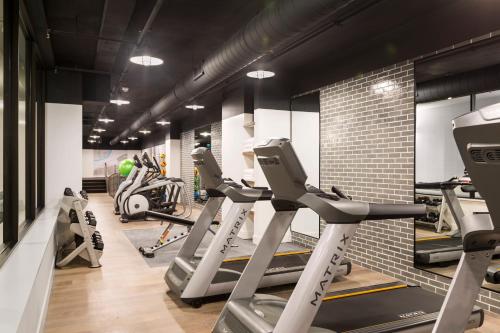 a gym with treadmills and elliptical machines at Kimpton Aertson Hotel, an IHG Hotel in Nashville