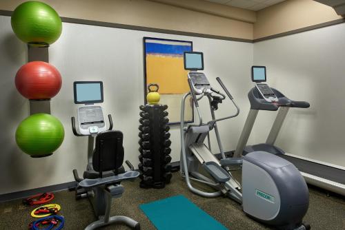 a gym with two exercise bikes and exercise balls at Kimpton Hotel Vintage Seattle, an IHG Hotel in Seattle