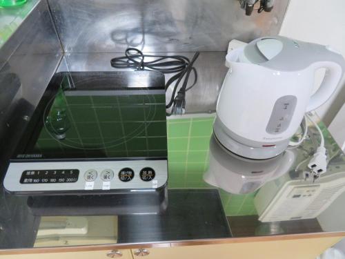 a mixer sitting on top of a kitchen counter at 札幌市中心部大通公園まで徒歩八分観光移動に便利なロケーションe507 in Sapporo