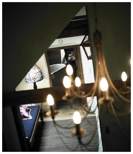 an overhead view of a living room with a chandelier at Relais & Châteaux Taubenkobel in Schützen am Gebirge