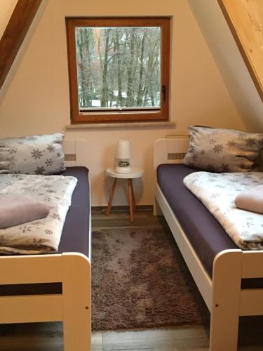 Postel nebo postele na pokoji v ubytování Ferienhaus am Rachental
