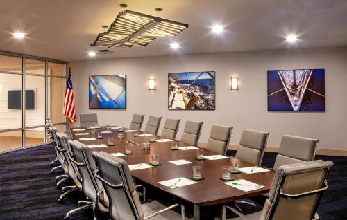 a conference room with a long table and chairs at Holiday Inn Newport News - Hampton by IHG in Newport News