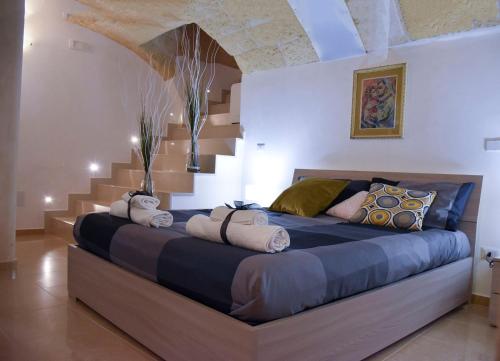 A bed or beds in a room at B&B borgo del capitolo