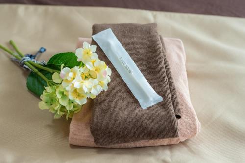 a bouquet of flowers sitting on top of a napkin at 札幌市中心部大通公園まで徒歩十分観光移動に便利なロケーションh602 in Sapporo