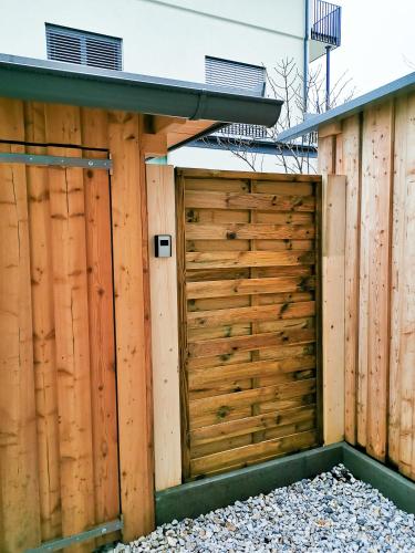 a wooden privacy fence with a roof at Am Millstättersee 35 in Döbriach
