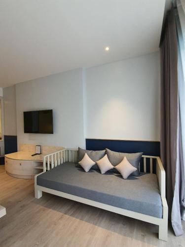 Ένα ή περισσότερα κρεβάτια σε δωμάτιο στο Seabed Grand Hotel Phuket - SHA Extra Plus
