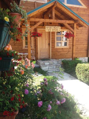 a small cabin with a sign on the front of it at Apartment Dea in Kolašin