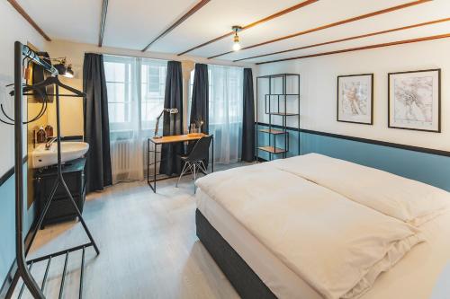 Säng eller sängar i ett rum på Pop Up Hotel Krone Zürich