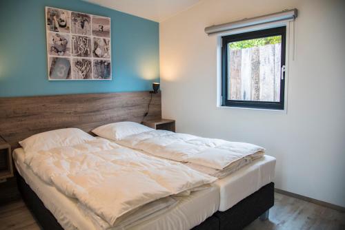 Postel nebo postele na pokoji v ubytování Beach Lodge