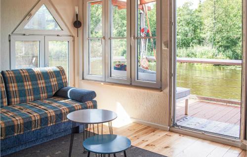 a living room with a couch and a table at Gorgeous Home In Mirow With Sauna in Mirow