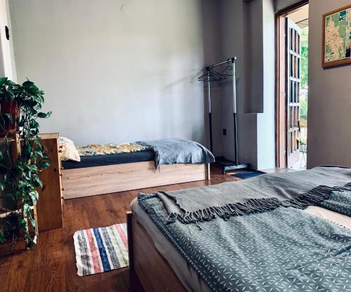 a bedroom with two beds in a room at Vár-Lak Apartman in Eger