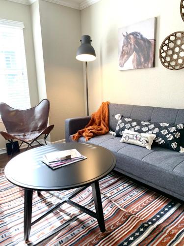 a living room with a couch and a table at Spacious 2BR&2BA Med Center APT, Free parking&shuttle in Houston