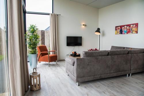 TV a/nebo společenská místnost v ubytování Beach Lodge