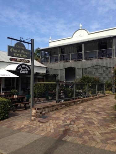 a building with a sign in front of it at Heritage Guesthouse in South West Rocks