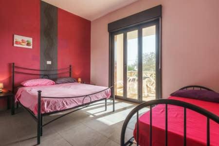 Posteľ alebo postele v izbe v ubytovaní Villa Vacanze Giuseppe