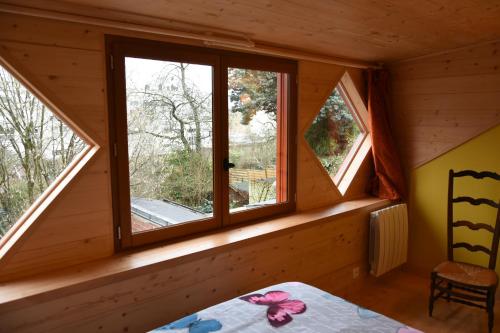 Postel nebo postele na pokoji v ubytování la maison aux jardins