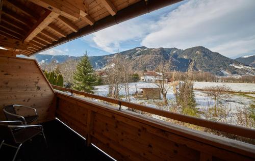 a balcony with a view of a snowy mountain at Apartments Lakeside 29 Zell am See in Zell am See